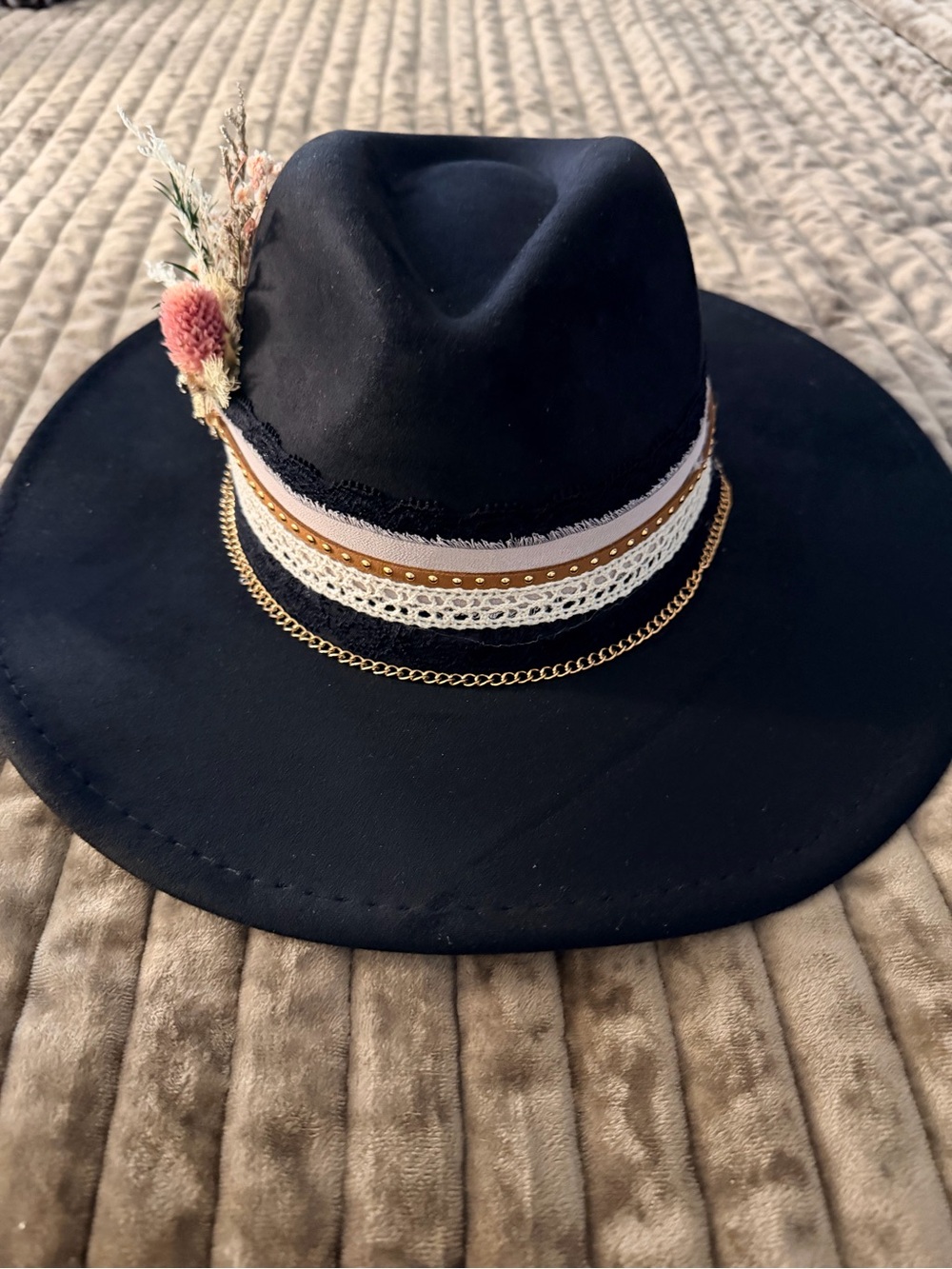 Black Wide-Brim Fedora with Decorative Band and Floral Accent